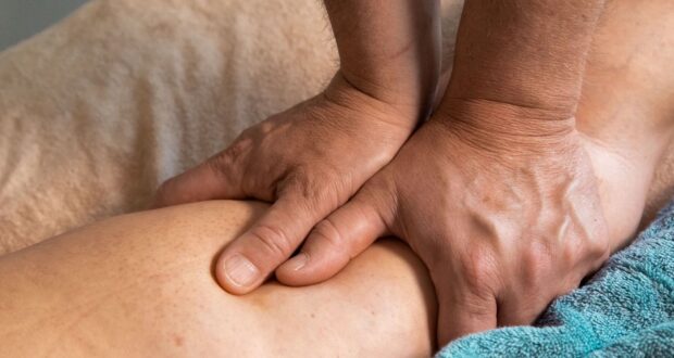 persons feet on blue towel