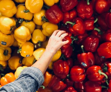 person holding bell pepper