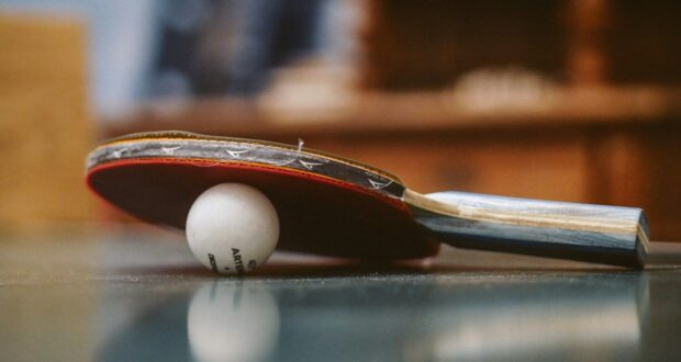 white golf ball on blue table